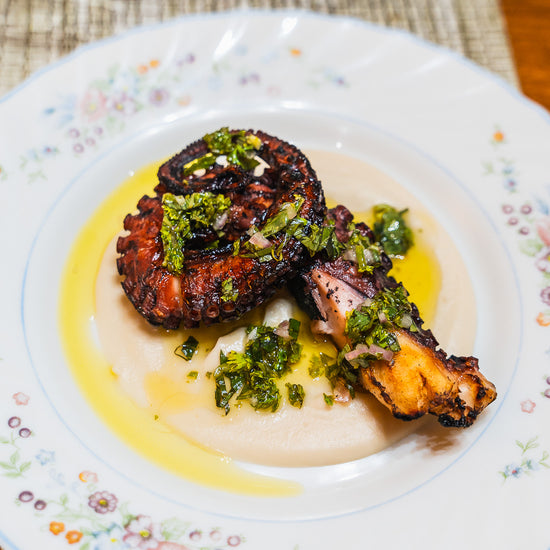 sous vide octopus tentacle on white bean puree, topped with chimichurri