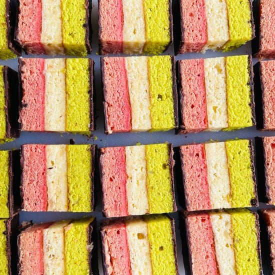 Sliced Italian rainbow cookies in rows face up