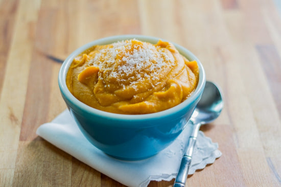 ginger-coconut mashed sweet potatoes in a blue bowl