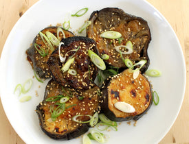 Sliced sous vide eggplant broiled with miso and topped with scallions